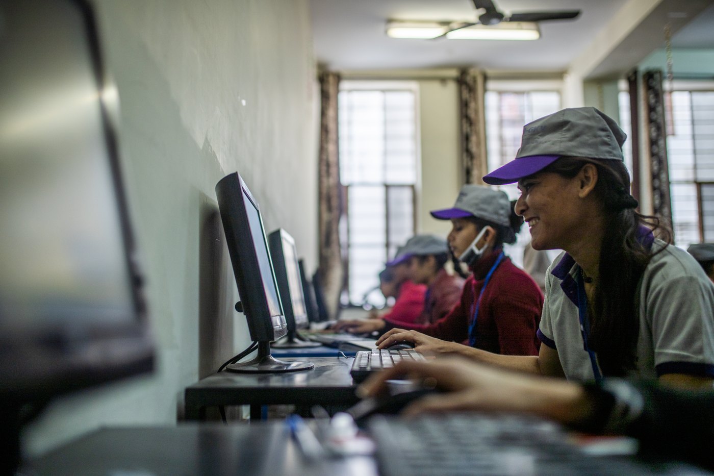 Young women at computer workstations in a training centre
